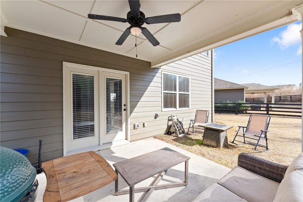 6667 Rivergreen Road Flowery Branch, GA 30542 - Photo 38 of 50 a outdoor living space with patio furniture