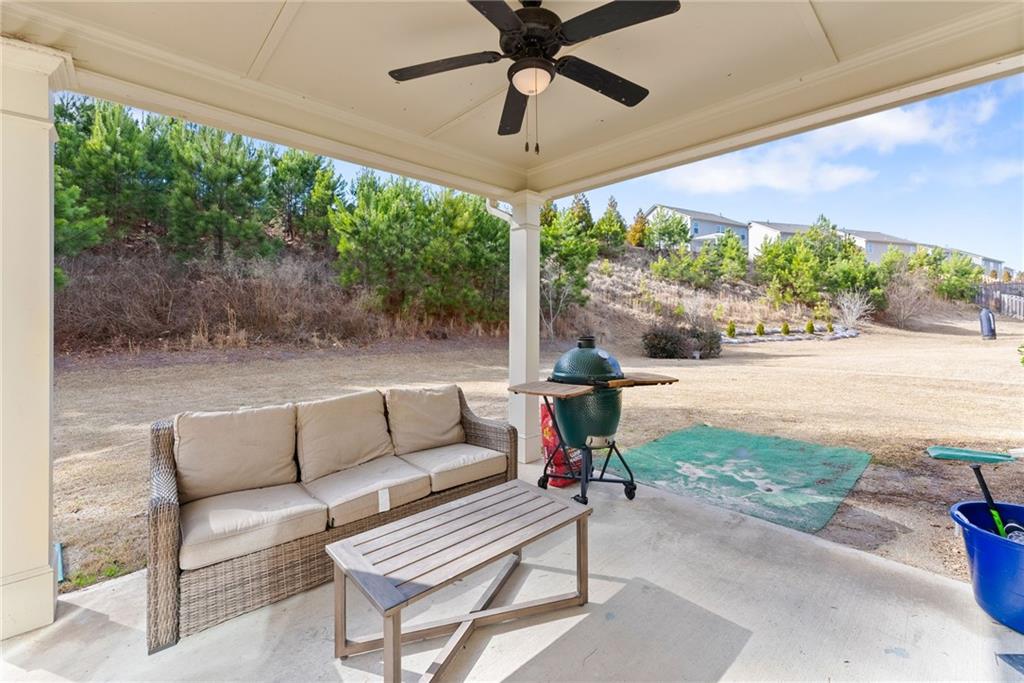 6667 Rivergreen Road Flowery Branch, GA 30542 - Photo 39 of 50 a outdoor living space with furniture and a garden