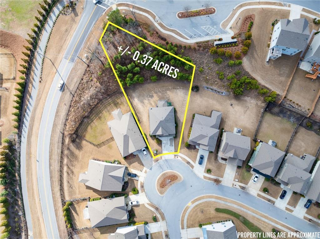 6667 Rivergreen Road Flowery Branch, GA 30542 - Photo 4 of 50 an aerial view of a house with garden space and furniture