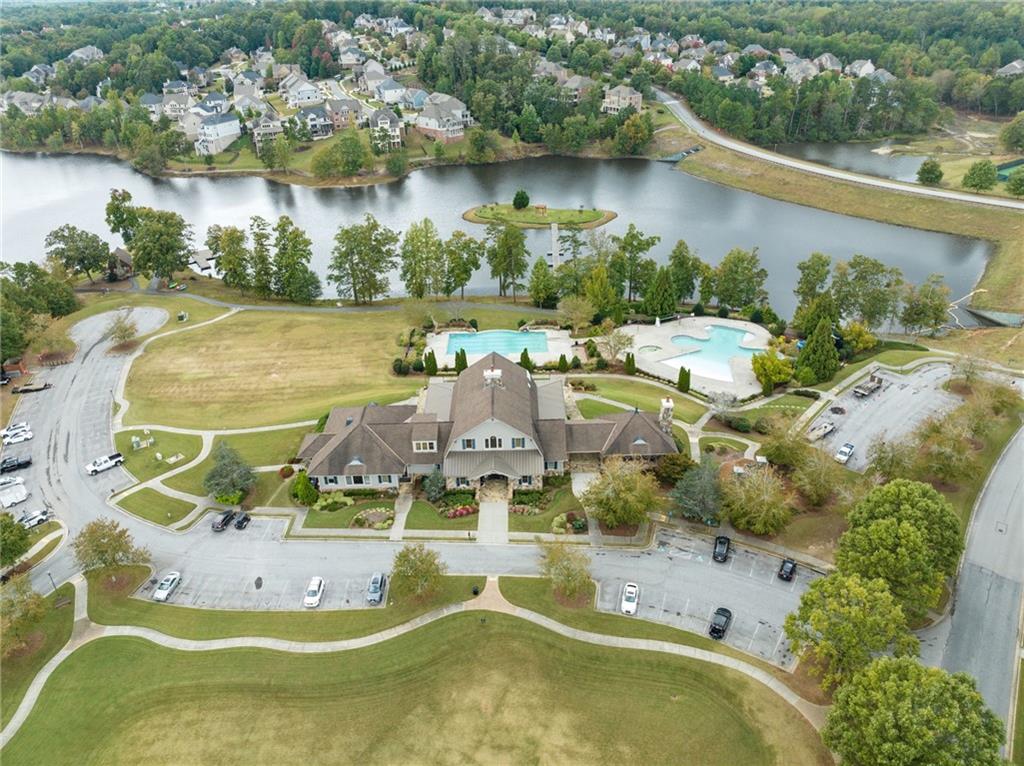 6667 Rivergreen Road Flowery Branch, GA 30542 - Photo 45 of 50 an aerial view of a house with a lake view