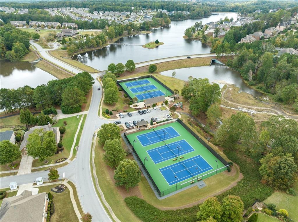 6667 Rivergreen Road Flowery Branch, GA 30542 - Photo 47 of 50 an aerial view of a house with a yard and lake view