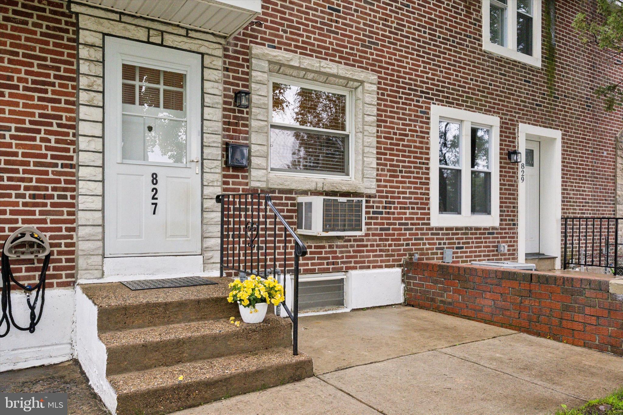 827 Grant Road Folcroft, PA 19032 - Photo 4 of 28 a front view of a house with a garden