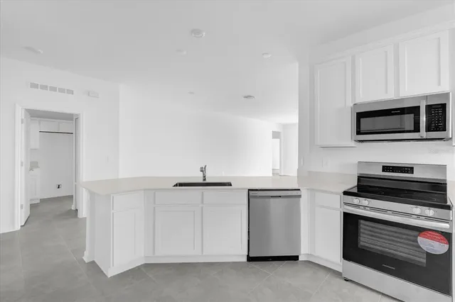 a bathroom with a sink a mirror and a bath tub