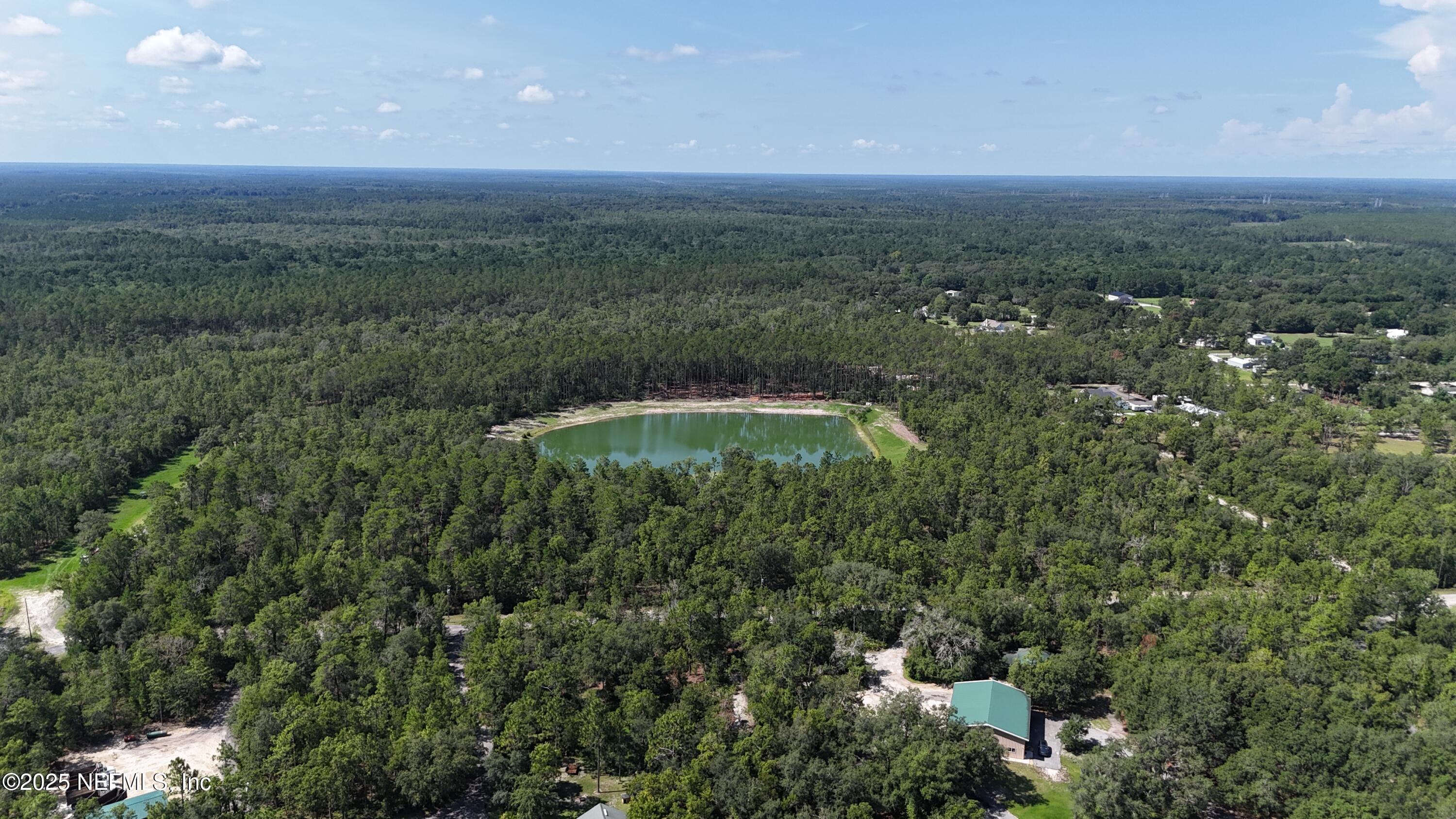 3212 Thunder Road Middleburg, FL 32068 - Photo 14 of 17 a view of a green field with lots of bushes