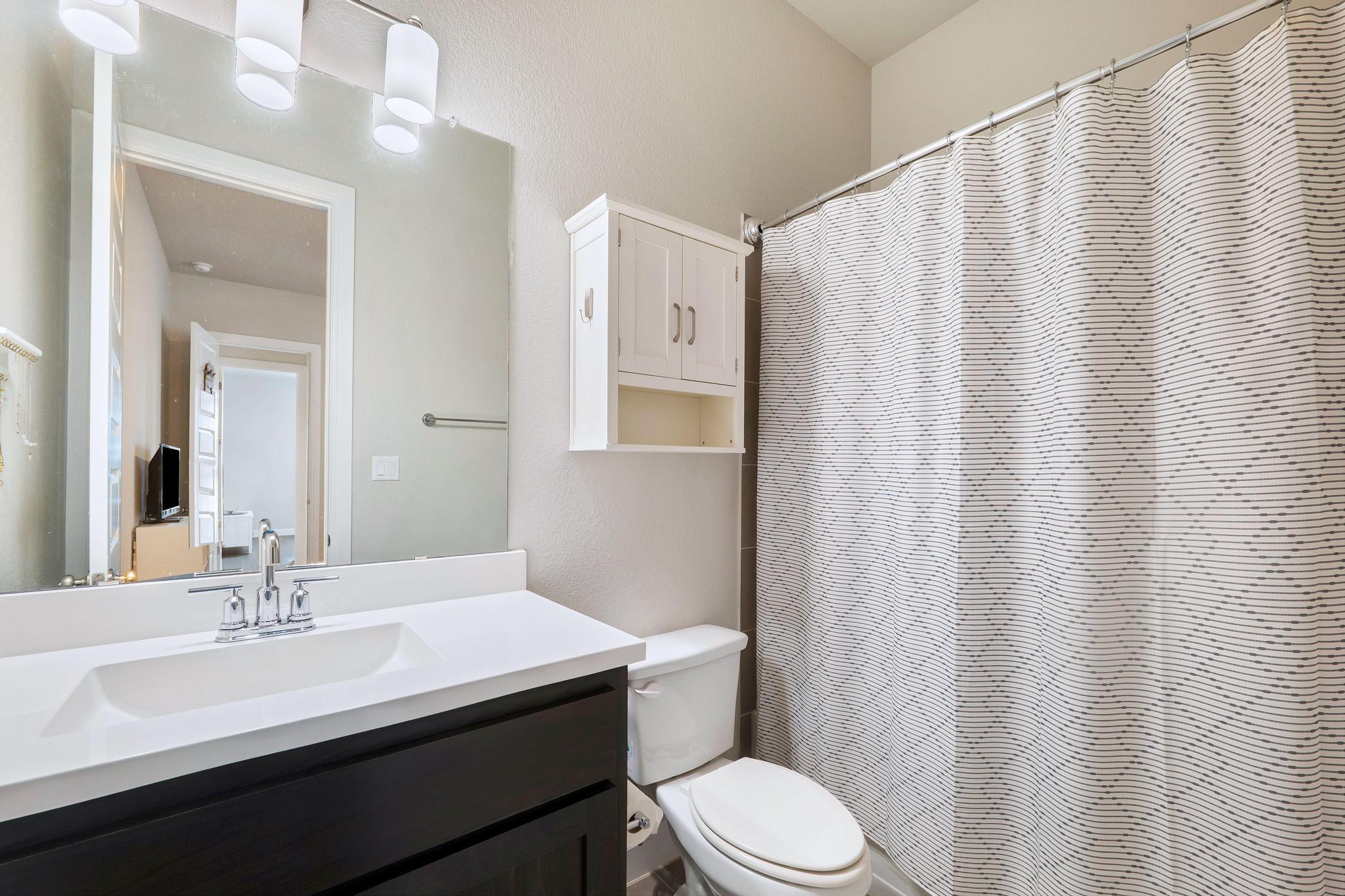 1009 Legacy Crossing Georgetown, TX 78628 - Photo 10 of 40 A well-appointed bath features modern fixtures and ample storage solutions.