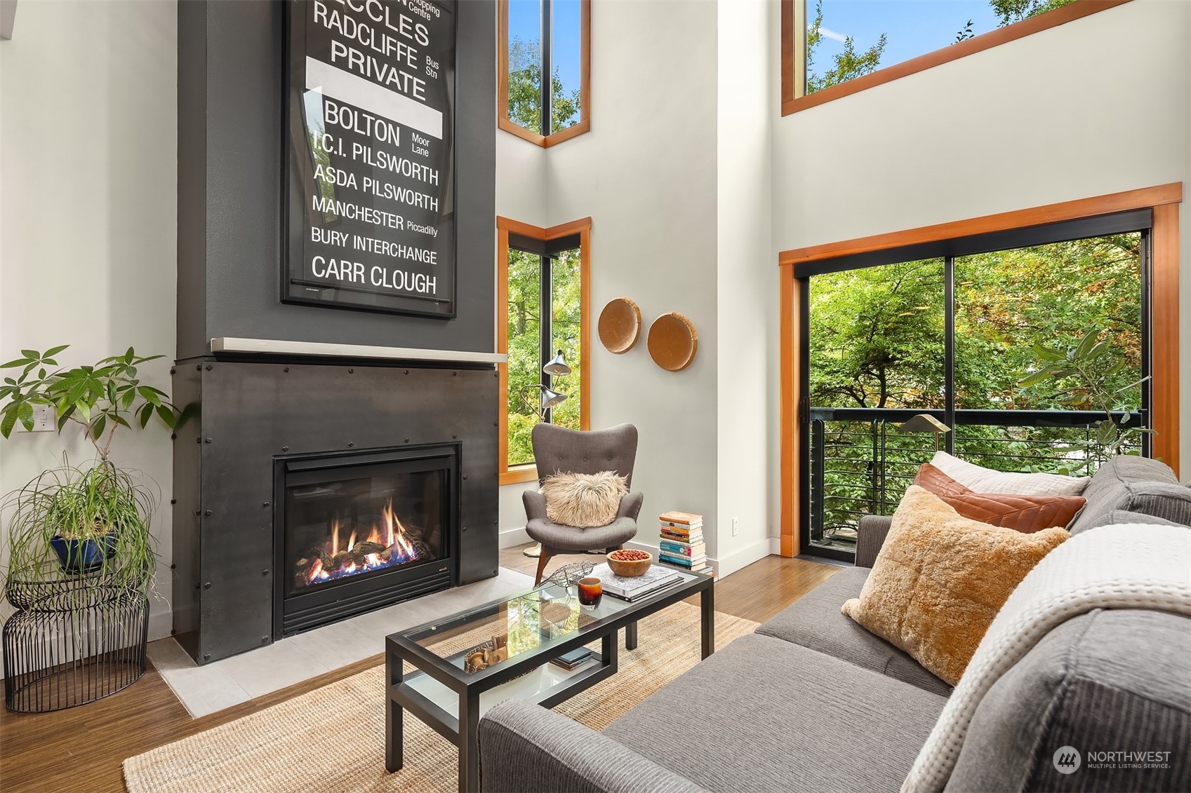 1605 East Pike Street, Unit 201 Seattle, WA 98122 - Photo 1 of 20 a living room with furniture and a fireplace