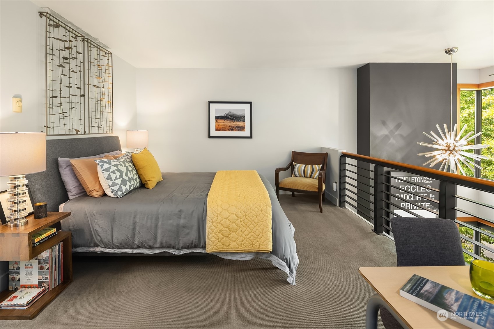 1605 East Pike Street, Unit 201 Seattle, WA 98122 - Photo 11 of 20 a bedroom with a bed and wooden floor
