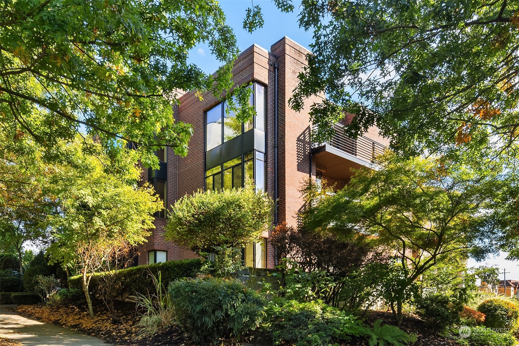 1605 East Pike Street, Unit 201 Seattle, WA 98122 - Photo 20 of 20 front view of a house with a tree