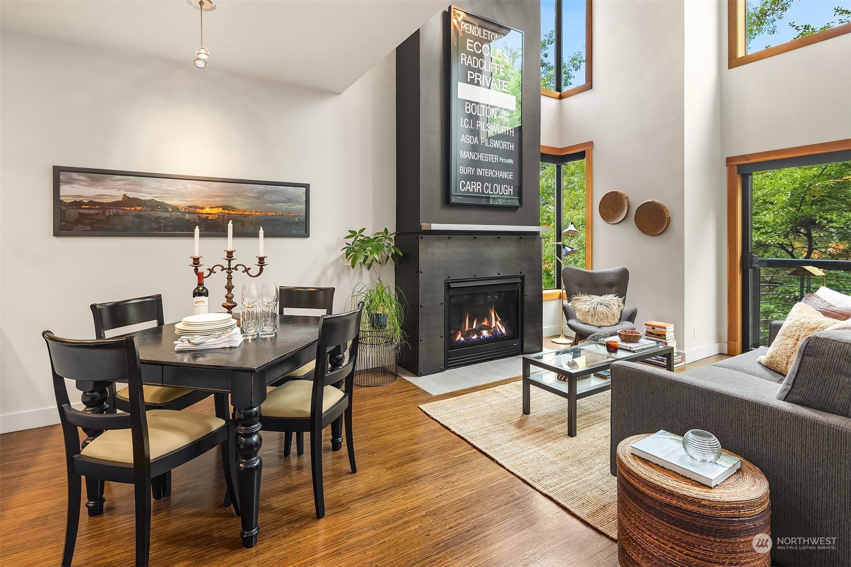 1605 East Pike Street, Unit 201 Seattle, WA 98122 - Photo 3 of 20 a living room with furniture a fireplace and a table