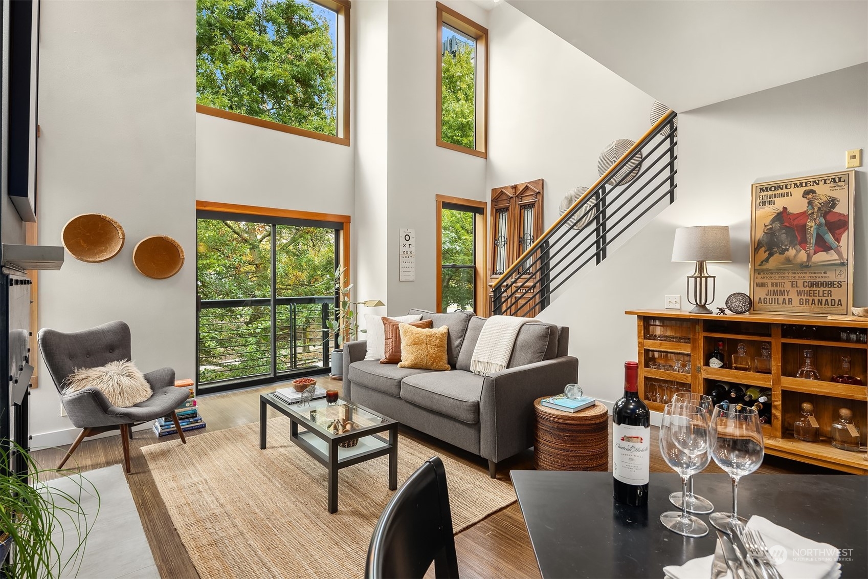 1605 East Pike Street, Unit 201 Seattle, WA 98122 - Photo 4 of 20 a living room with furniture and a floor to ceiling window
