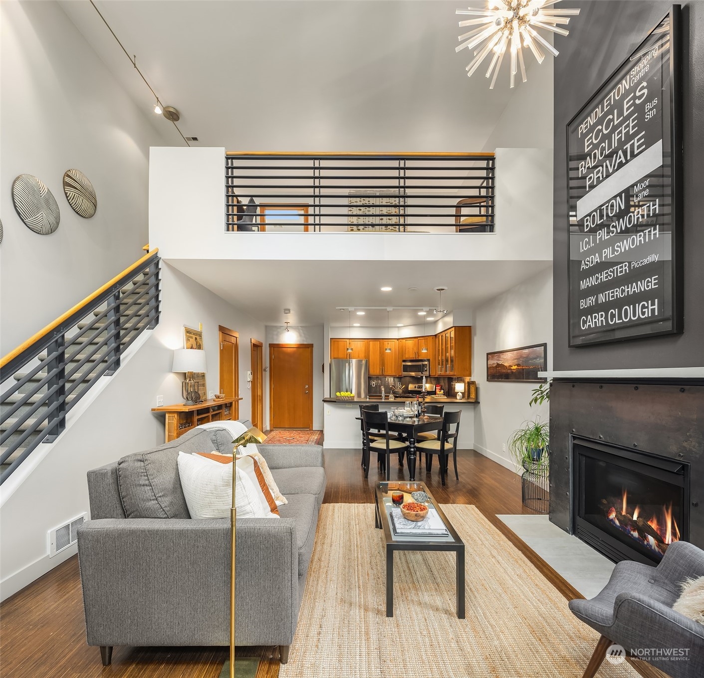 1605 East Pike Street, Unit 201 Seattle, WA 98122 - Photo 5 of 20 a living room with furniture and a fireplace