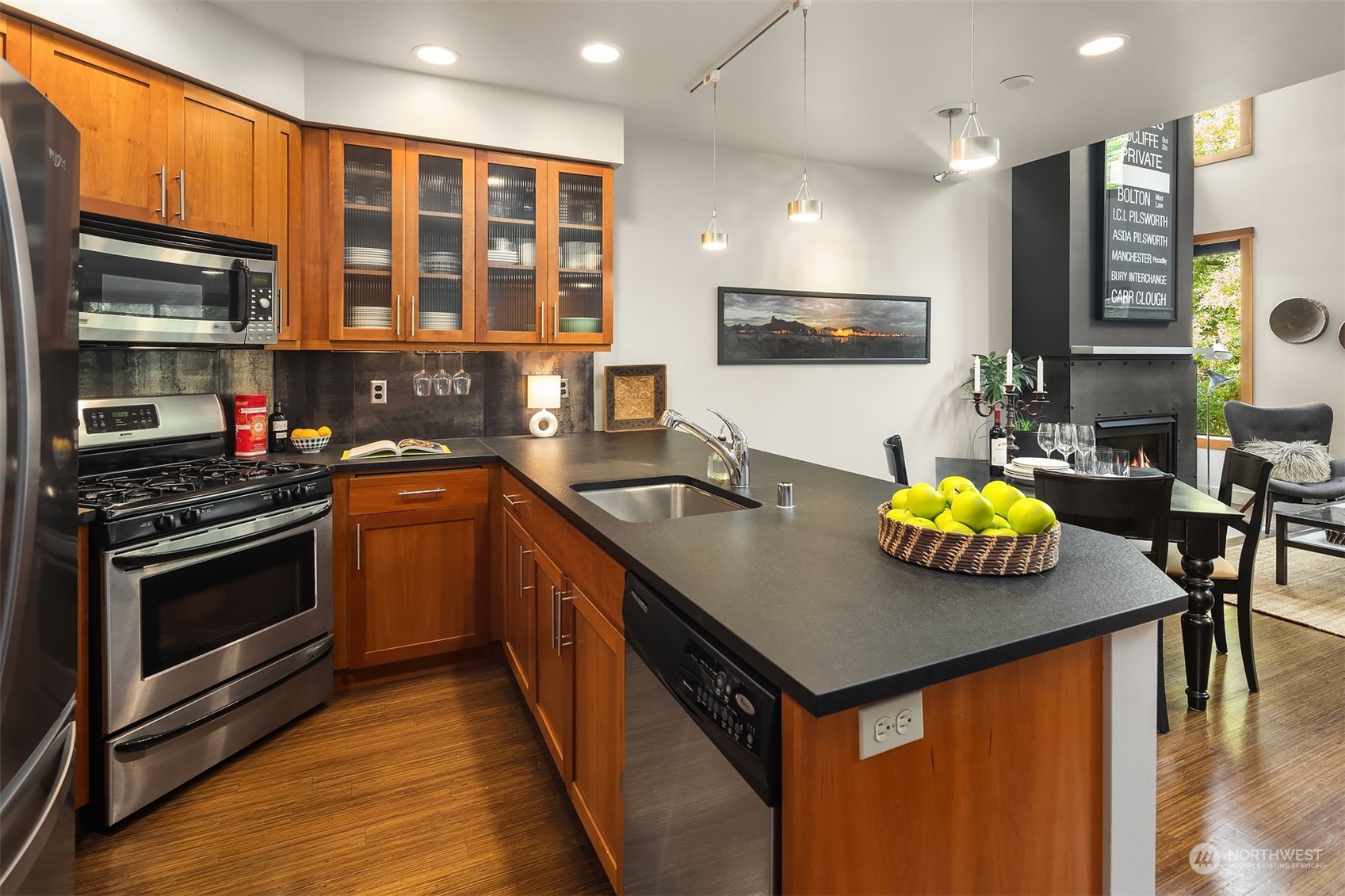 1605 East Pike Street, Unit 201 Seattle, WA 98122 - Photo 6 of 20 a kitchen with stainless steel appliances a stove a sink and a microwave