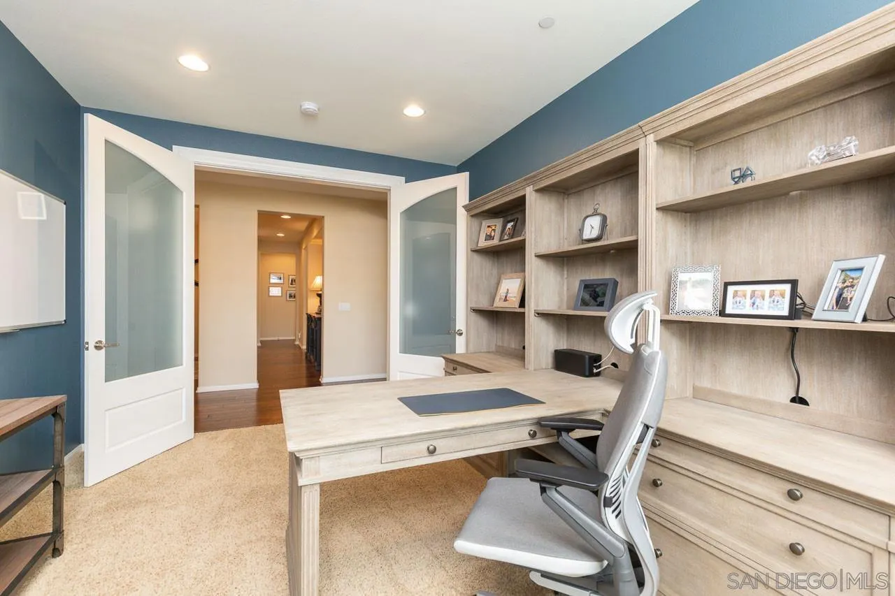 17662 Ralphs Ranch Road San Diego, CA 92127 - Photo 12 of 27 a room with a wooden floor and furniture
