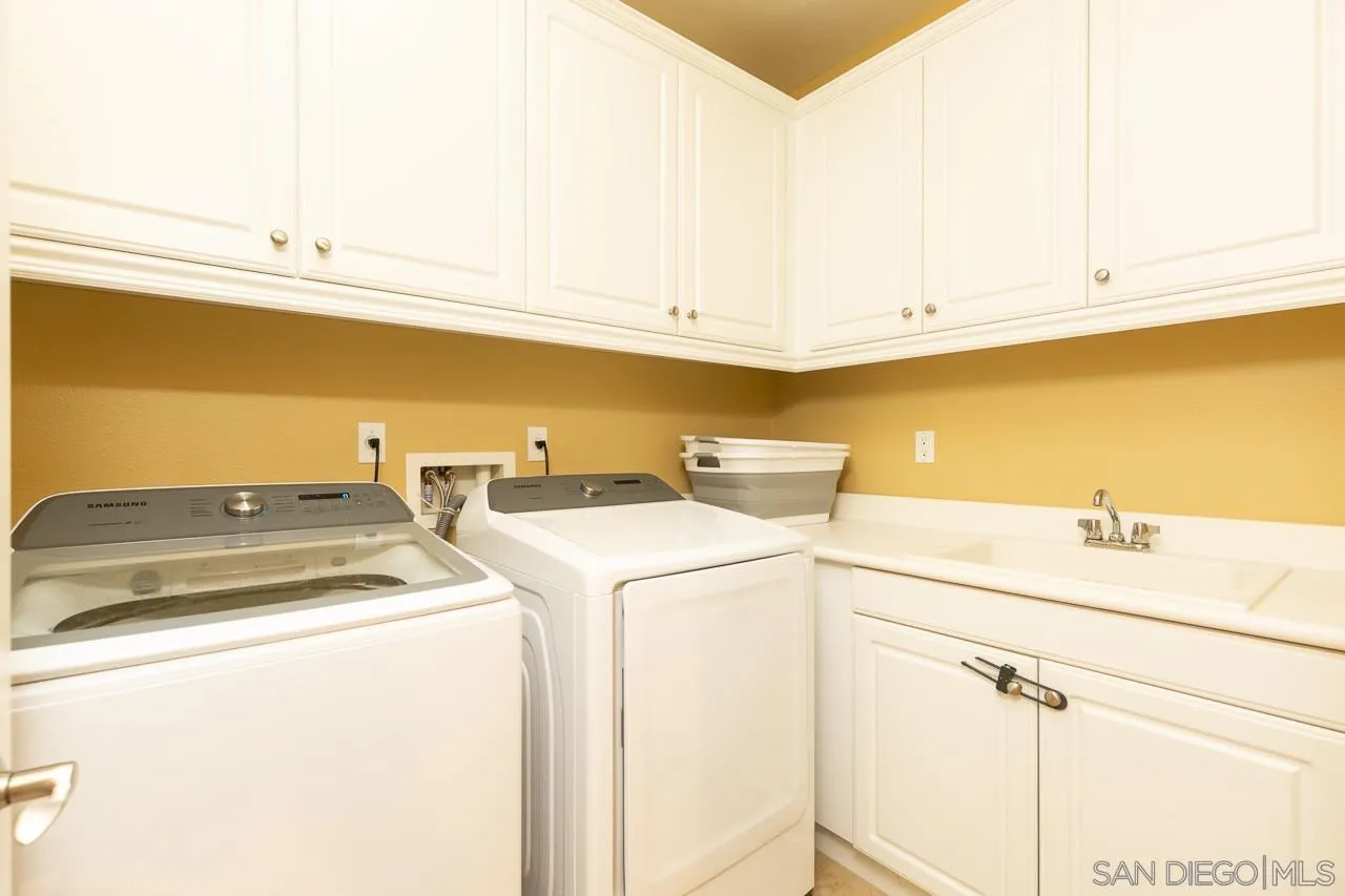 17662 Ralphs Ranch Road San Diego, CA 92127 - Photo 17 of 27 a utility room with dryer and washer