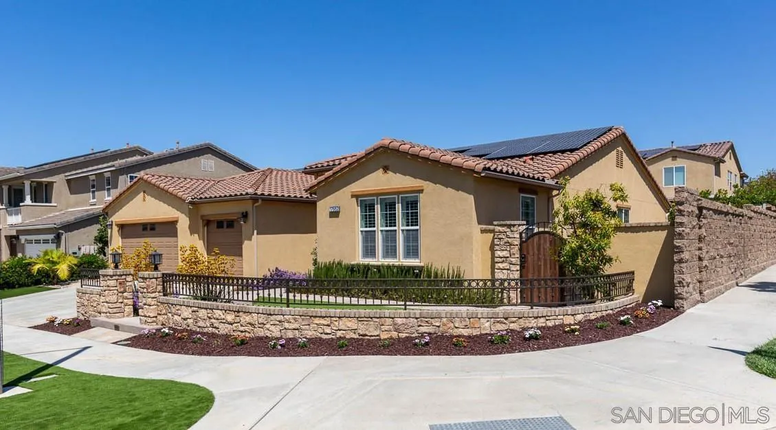 17662 Ralphs Ranch Road San Diego, CA 92127 - Photo 2 of 27 a front view of a house with garden