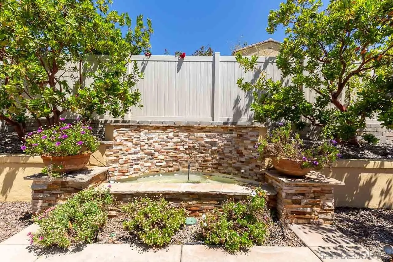 17662 Ralphs Ranch Road San Diego, CA 92127 - Photo 24 of 27 a view of a yard with plants and large trees