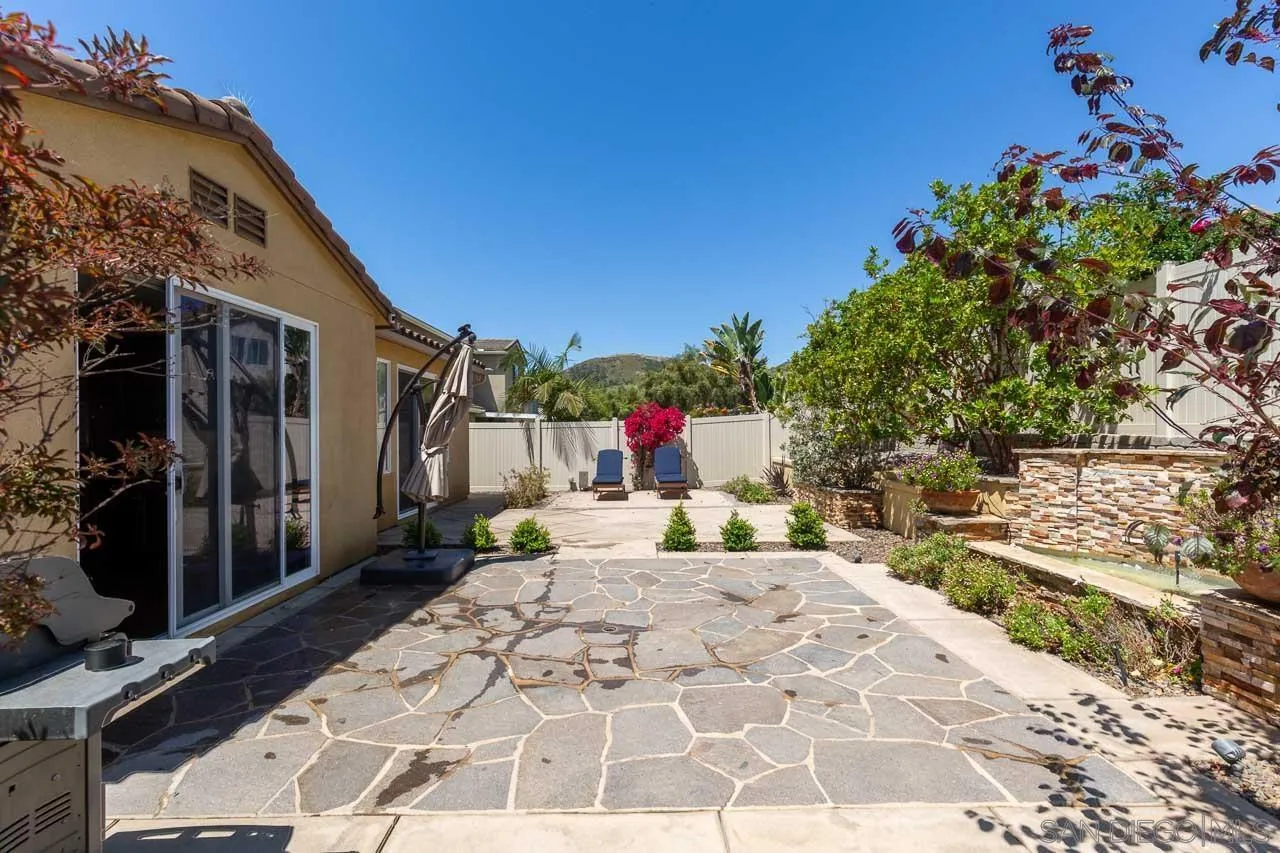 17662 Ralphs Ranch Road San Diego, CA 92127 - Photo 27 of 27 a view of a backyard with sitting area