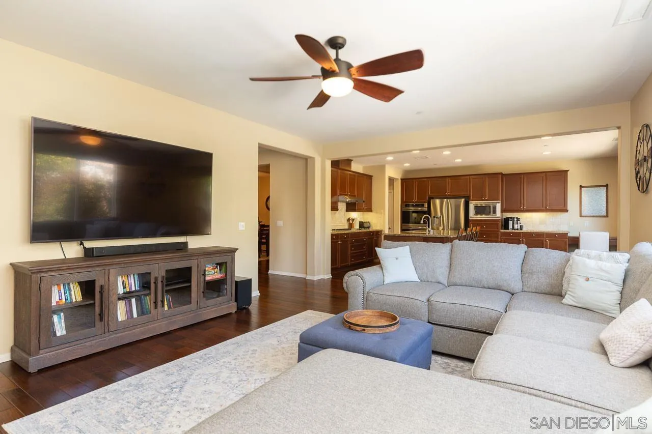 17662 Ralphs Ranch Road San Diego, CA 92127 - Photo 8 of 27 a living room with furniture and a flat screen tv
