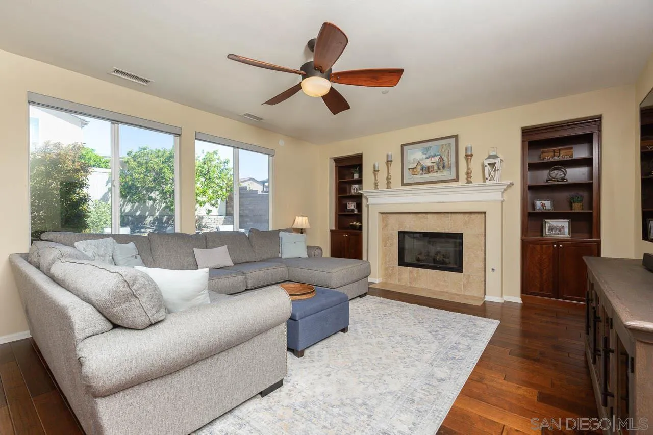 17662 Ralphs Ranch Road San Diego, CA 92127 - Photo 9 of 27 a living room with furniture and a fireplace
