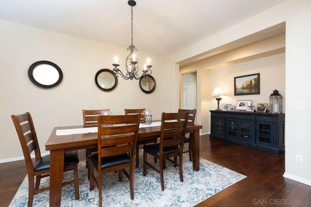 17662 Ralphs Ranch Road San Diego, CA 92127 - Photo 10 of 27 a view of a dining room and chandelier