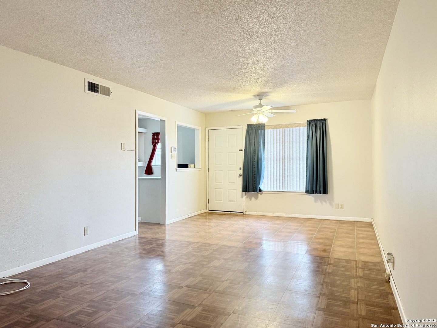 a view of a livingroom with wooden floor