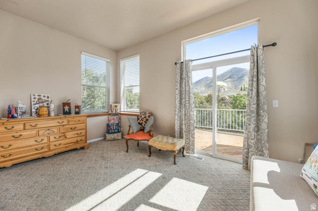 569 Elk Meadow Loop Tooele, UT 84074 - Photo 30 of 56 Sitting room featuring light carpet and a mountain view