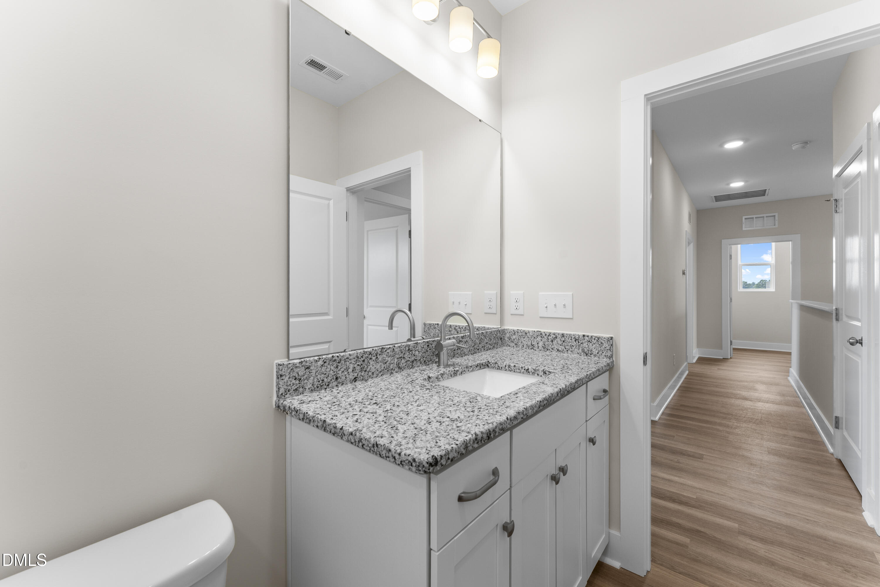 7628 New Sandy Hill Church Road Sims, NC 27880 - Photo 32 of 46 a bathroom with a granite countertop sink and a mirror