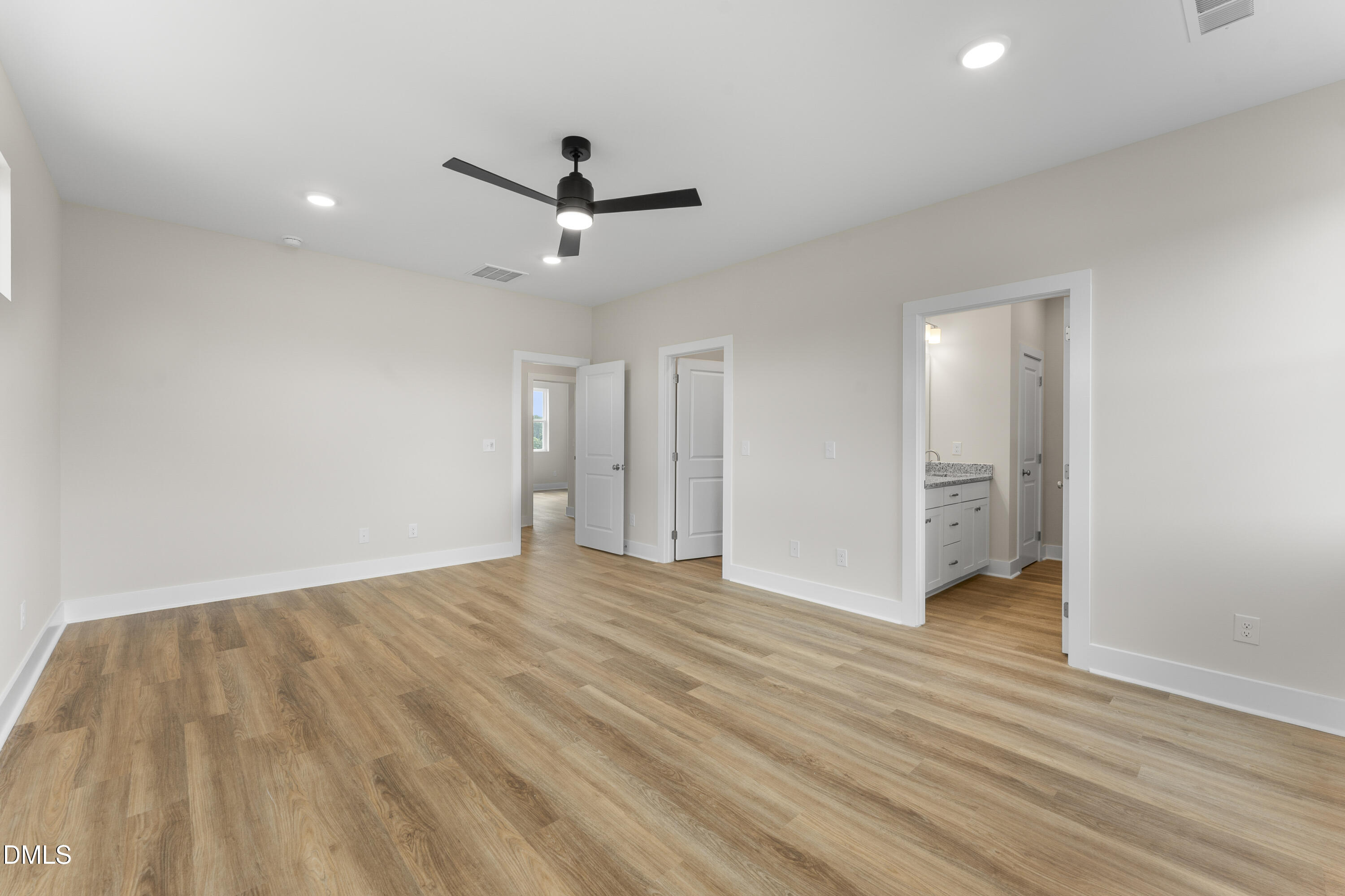 7628 New Sandy Hill Church Road Sims, NC 27880 - Photo 34 of 46 a view of empty room with wooden floor and fan