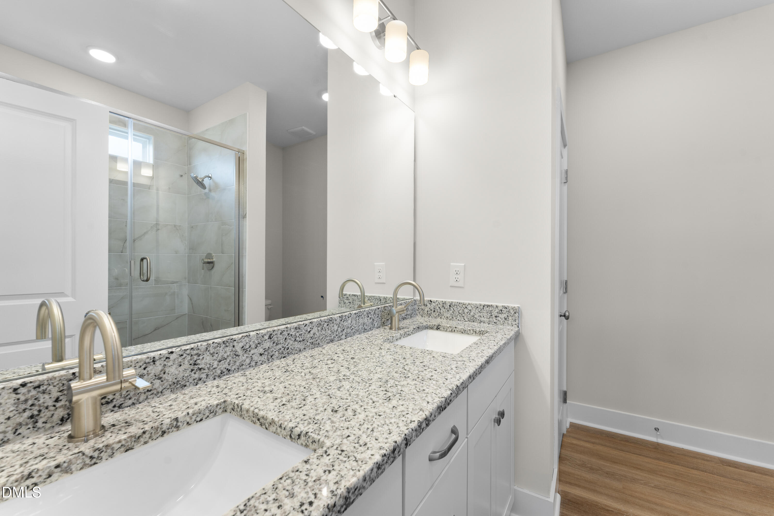 7628 New Sandy Hill Church Road Sims, NC 27880 - Photo 36 of 46 a bathroom with a granite countertop sink and a mirror