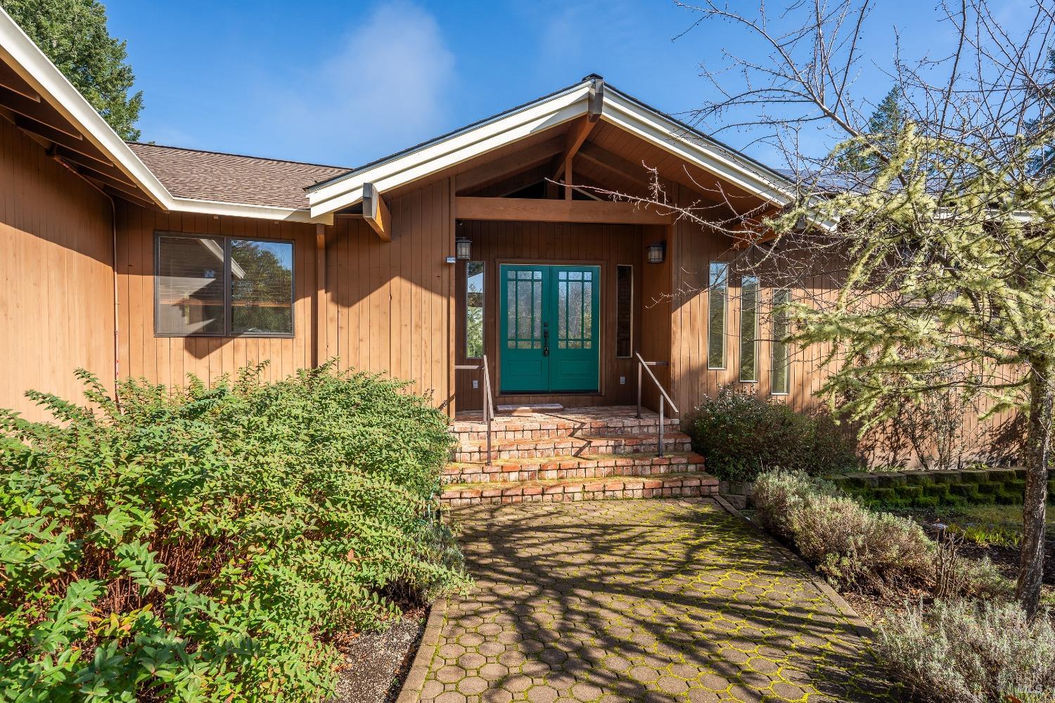 750 Highway 20 Willits, CA 95490 - Photo 1 of 1 a front view of a house with garden