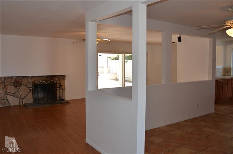 5776 Katherine Street Simi Valley, CA 93063 - Photo 4 of 11 a view of an empty room with wooden floor and a window