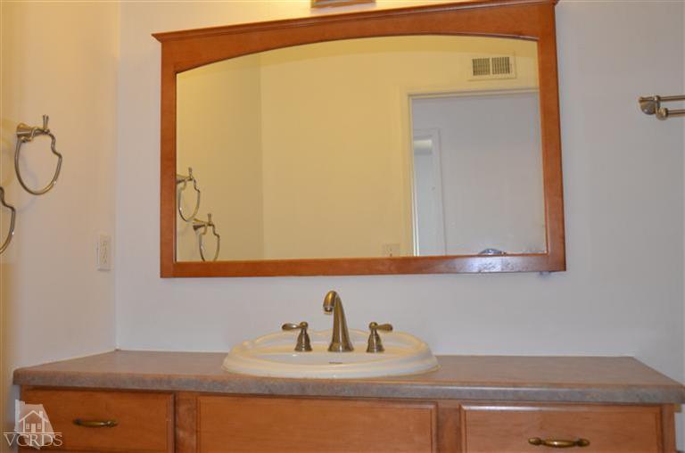 5776 Katherine Street Simi Valley, CA 93063 - Photo 8 of 11 a bathroom with a sink and a mirror