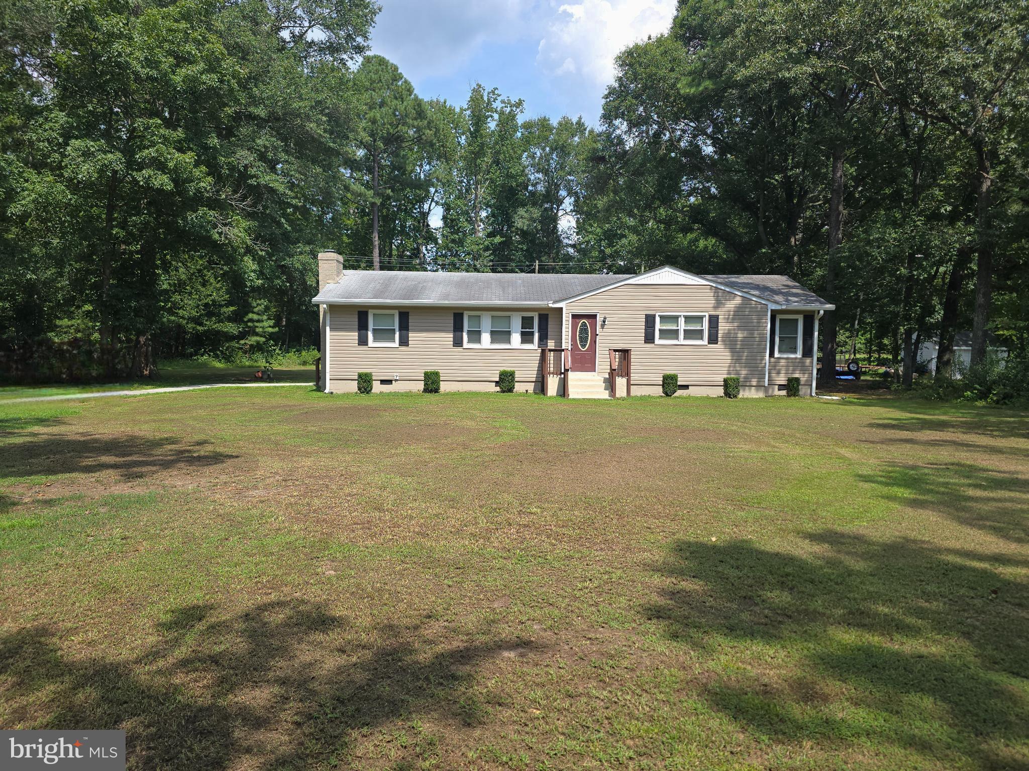 25073 Oxford Road Ruther Glen, VA 22546 - Photo 1 of 37 a front view of a house with a garden