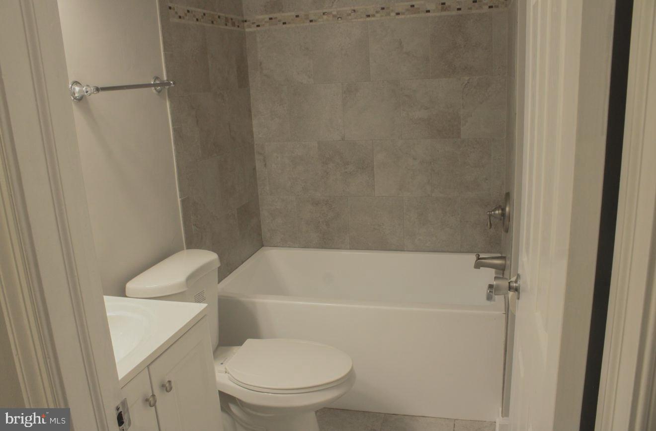 25073 Oxford Road Ruther Glen, VA 22546 - Photo 26 of 37 a white toilet sitting next to a bath tub