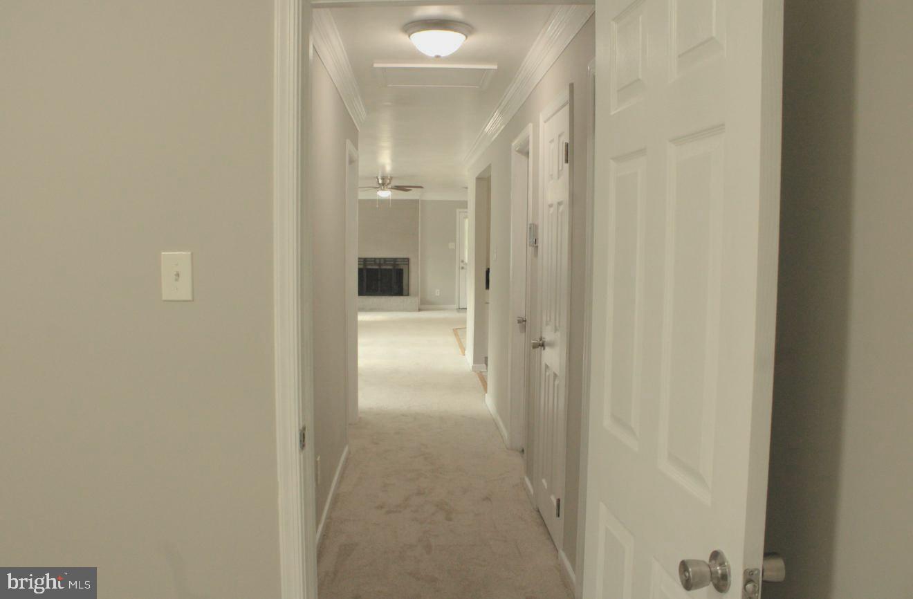 25073 Oxford Road Ruther Glen, VA 22546 - Photo 27 of 37 a view of a bathroom from a hallway