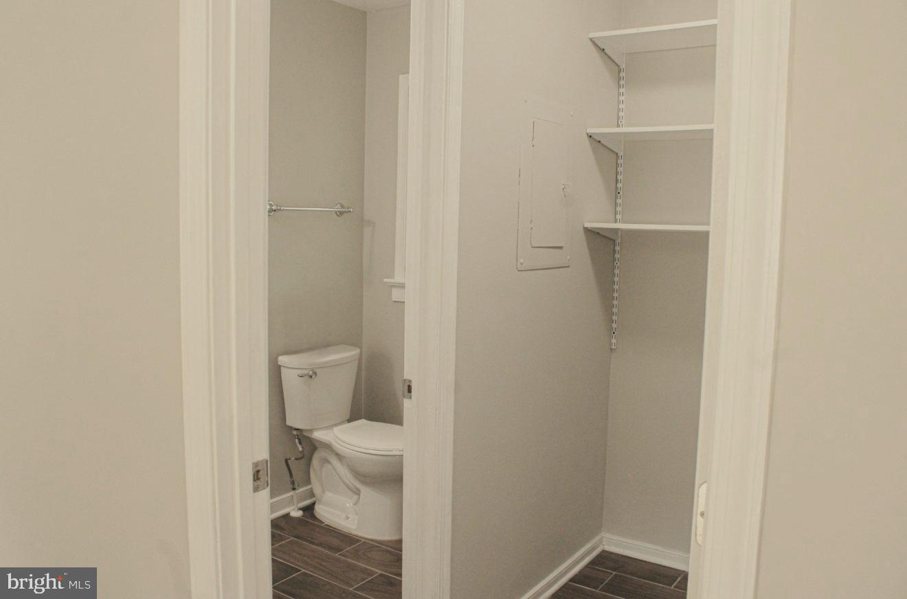 25073 Oxford Road Ruther Glen, VA 22546 - Photo 28 of 37 a bathroom with a granite countertop toilet and a sink