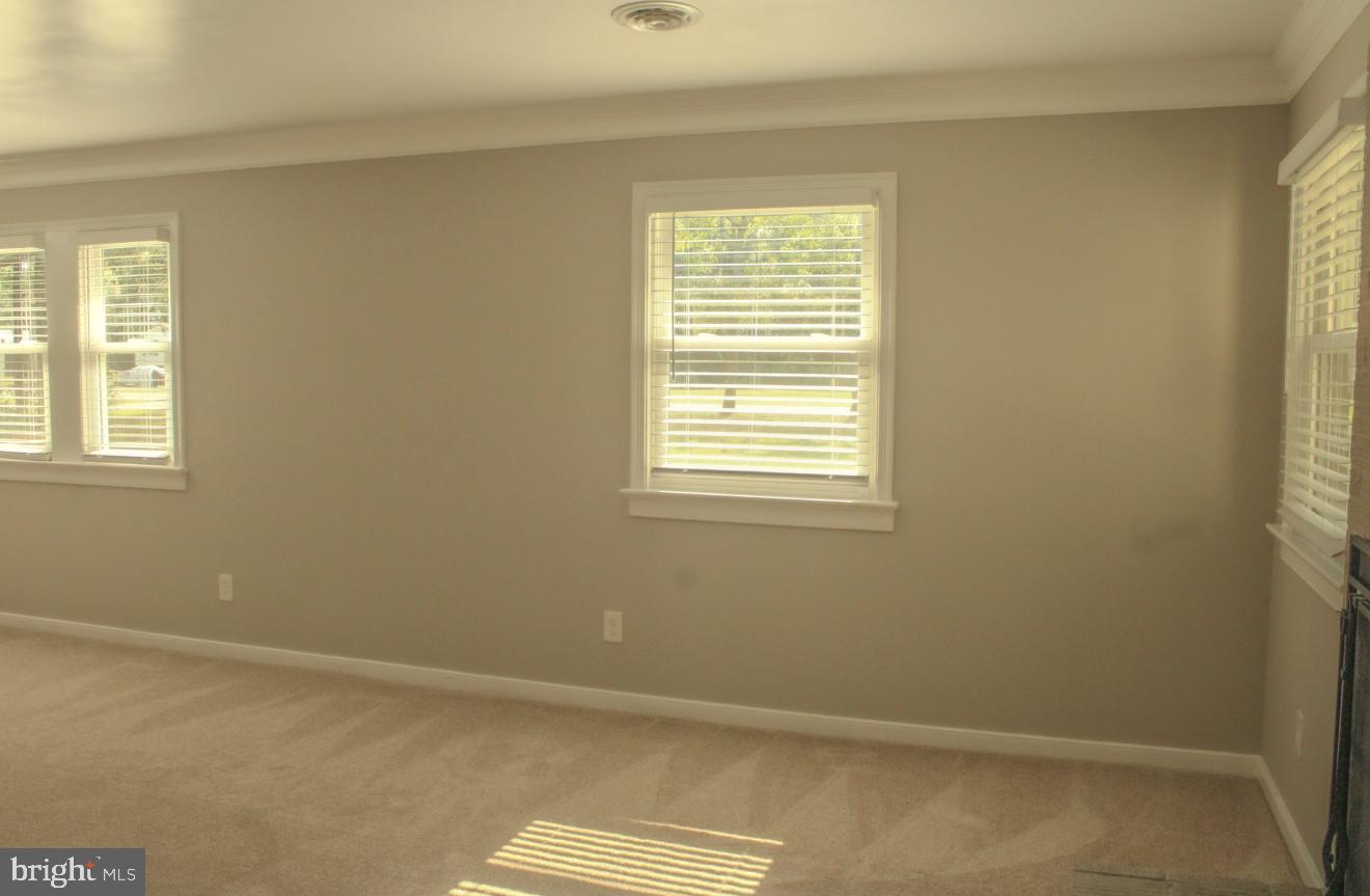 25073 Oxford Road Ruther Glen, VA 22546 - Photo 3 of 37 a view of an empty room with a window