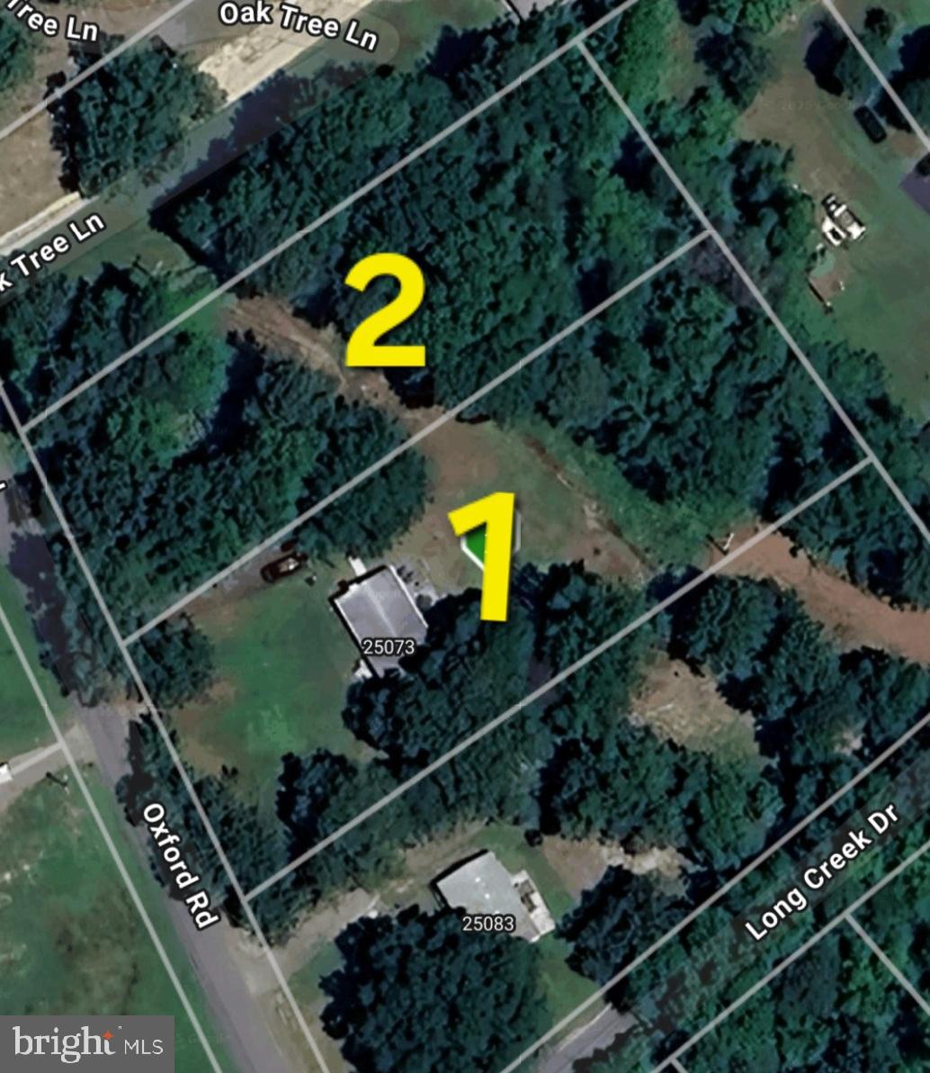 25073 Oxford Road Ruther Glen, VA 22546 - Photo 37 of 37 an aerial view of a house a garden and swimming pool