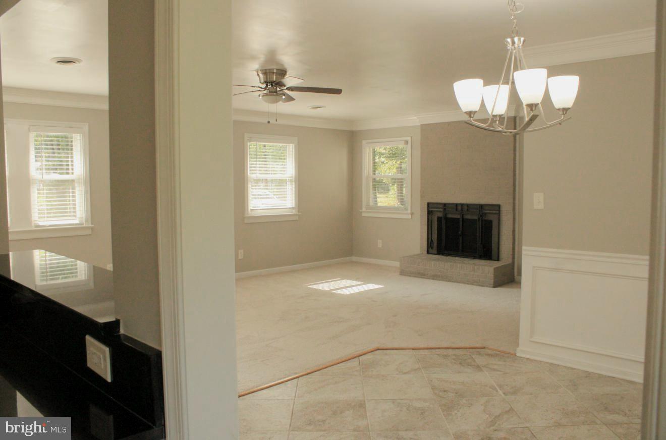 25073 Oxford Road Ruther Glen, VA 22546 - Photo 7 of 37 a view of a livingroom with a chandelier