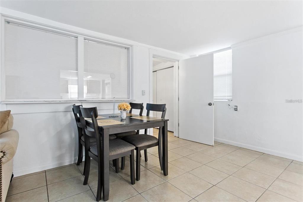 904 Lakeview Road, Unit B Clearwater, FL 33756 - Photo 16 of 19 a view of a dining room with furniture