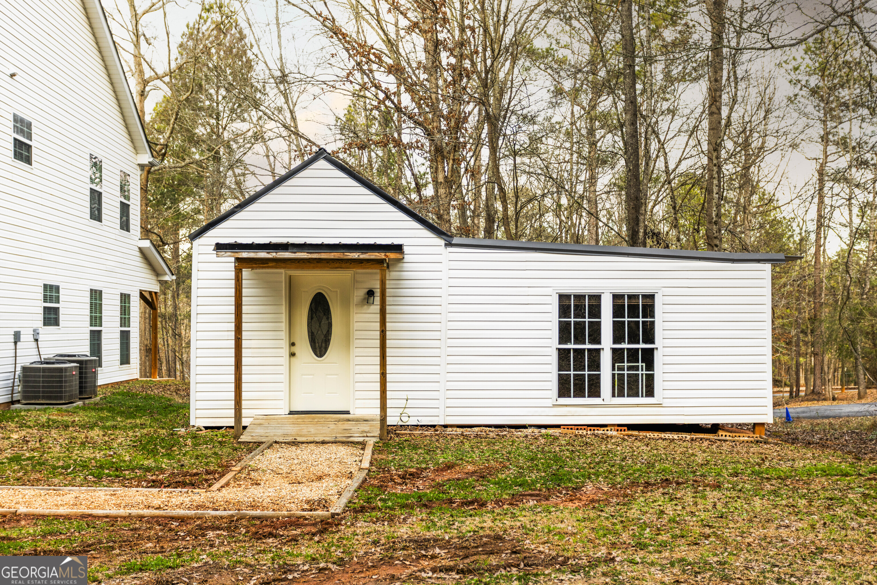931 Bethany Road Covington, GA 30016 - Photo 12 of 83 a house with trees in the background