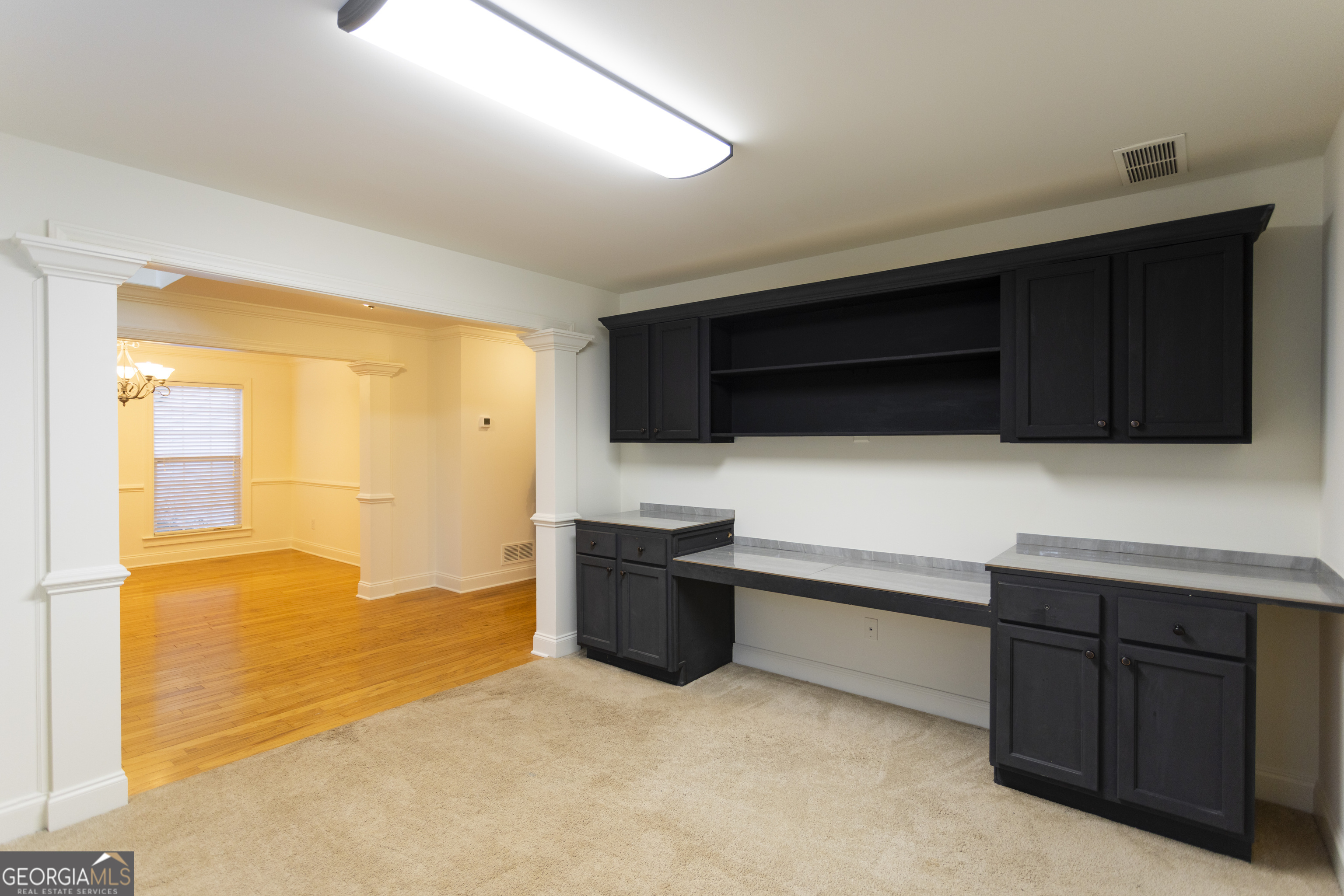 931 Bethany Road Covington, GA 30016 - Photo 25 of 83 a kitchen with stainless steel appliances a stove a microwave a sink and cabinets