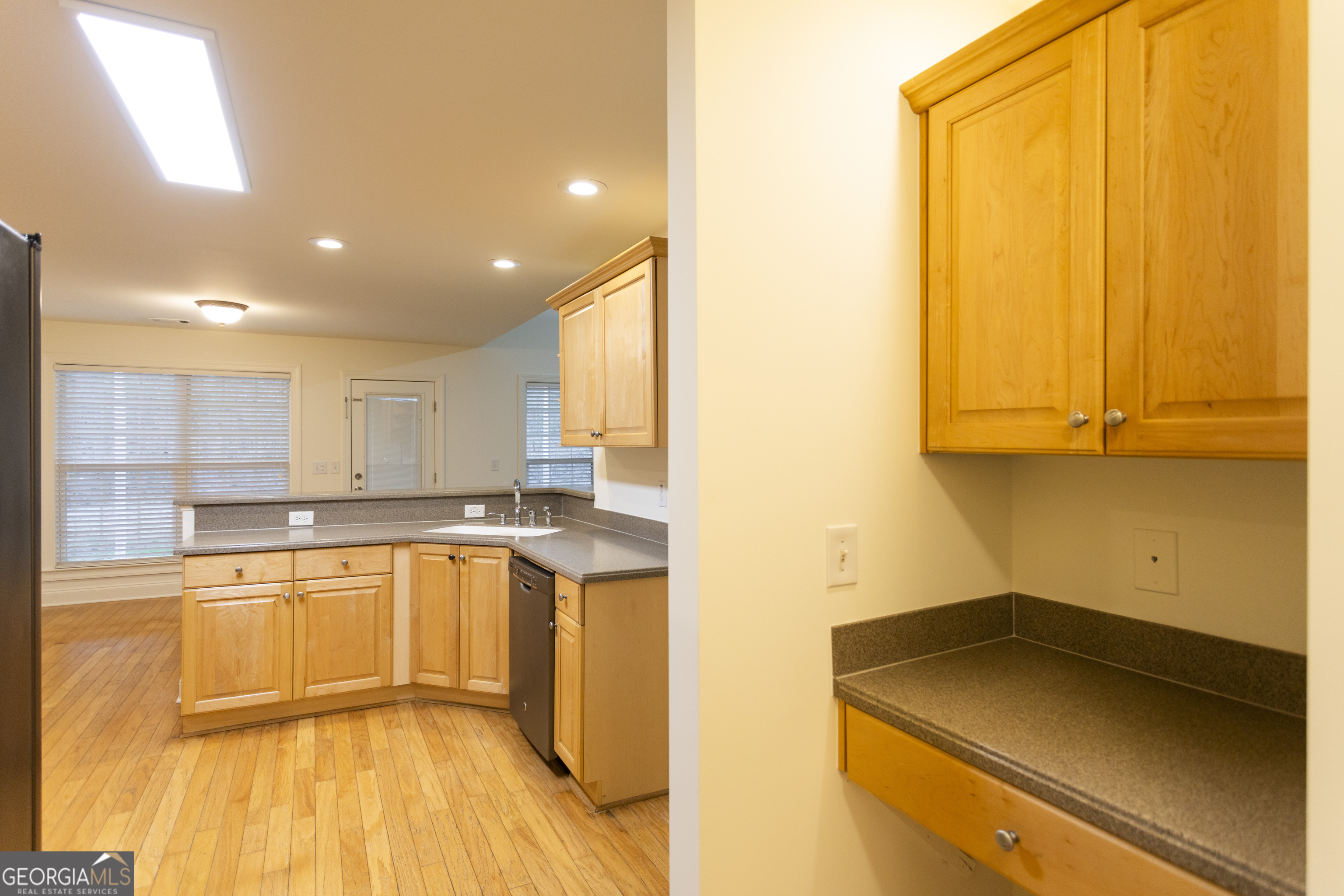 931 Bethany Road Covington, GA 30016 - Photo 31 of 83 a kitchen with a sink a window and cabinets