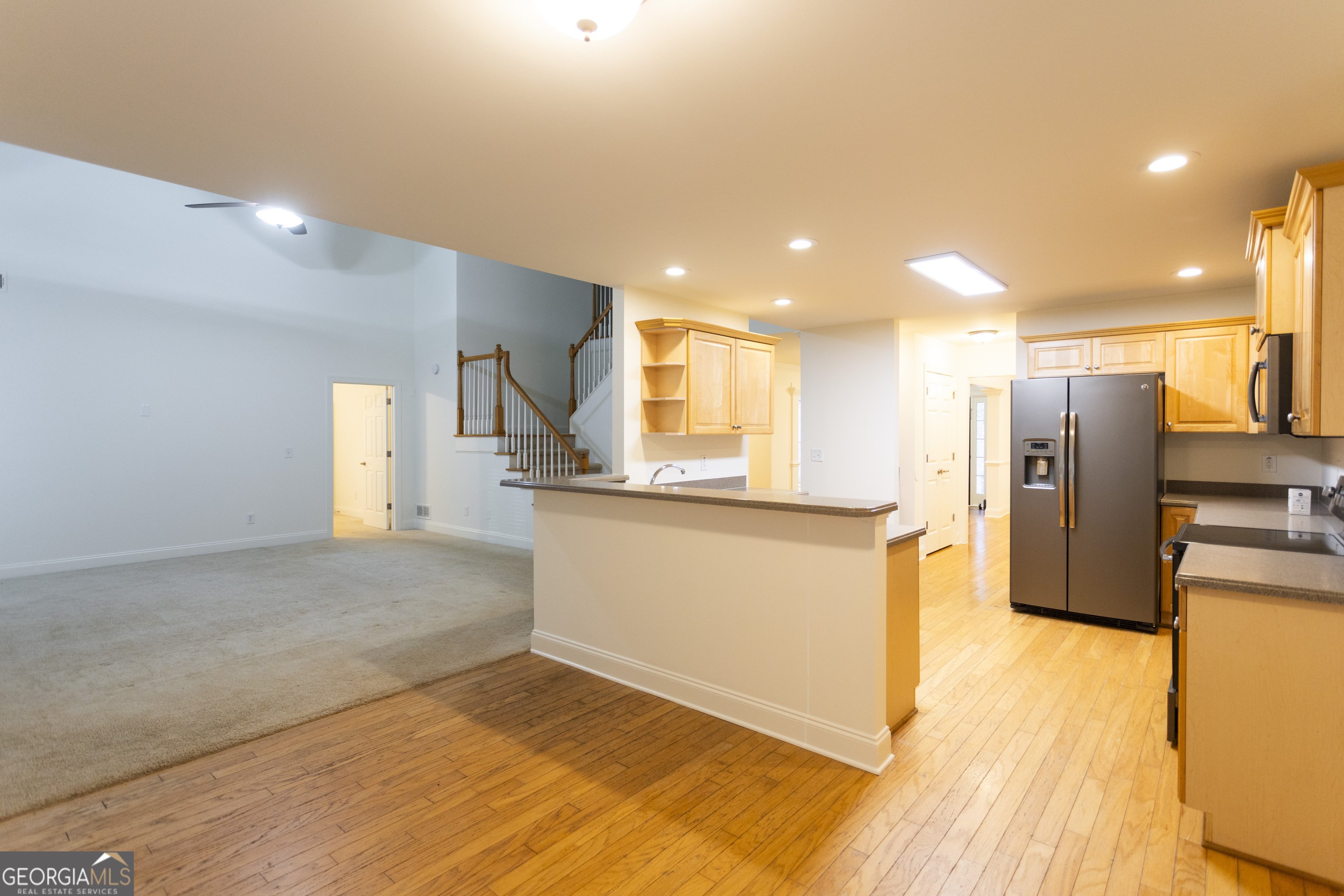 931 Bethany Road Covington, GA 30016 - Photo 34 of 83 a view of a kitchen with a refrigerator and a stove top oven