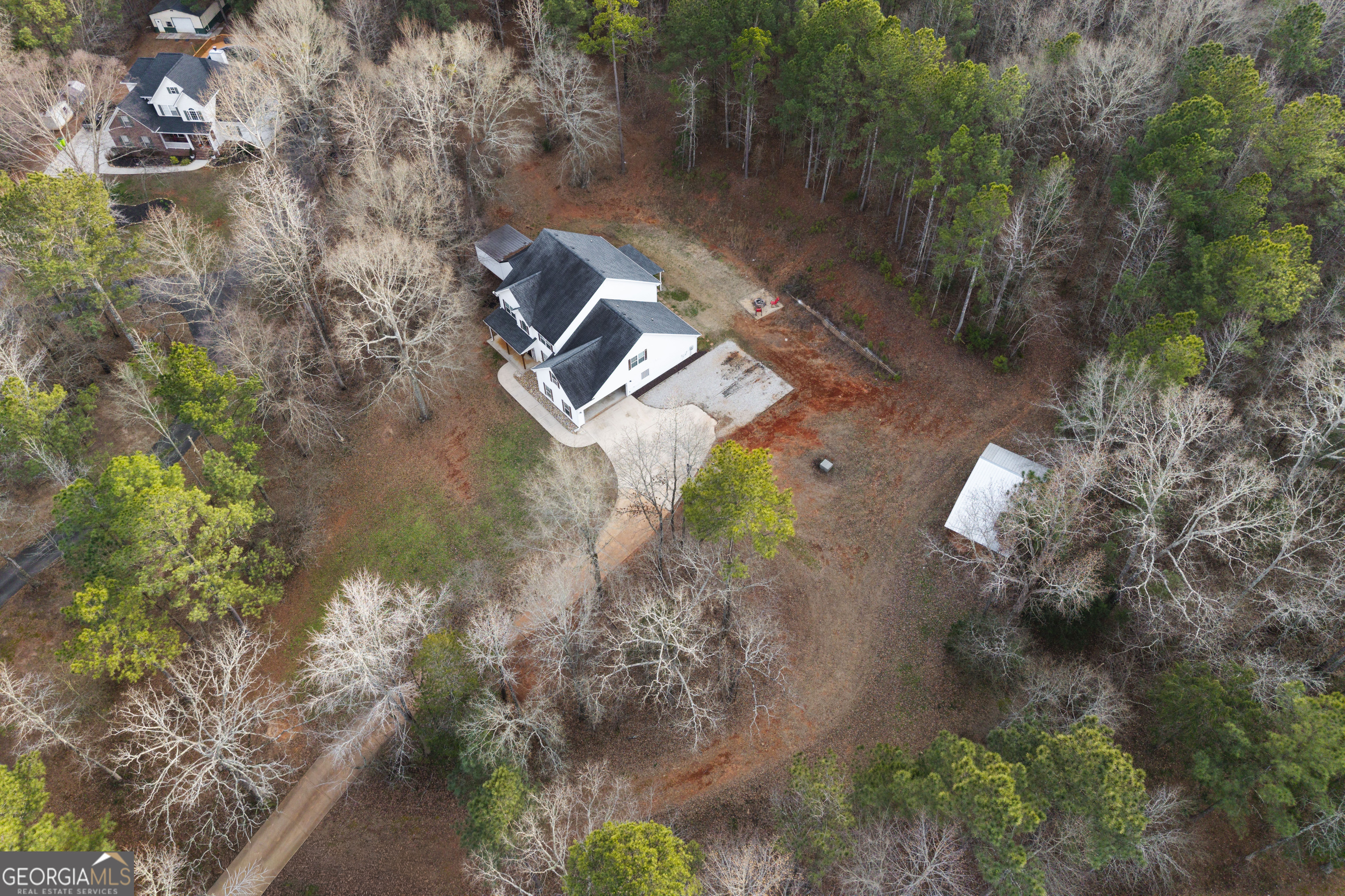931 Bethany Road Covington, GA 30016 - Photo 4 of 83 a view of a backyard with plants and a lake view