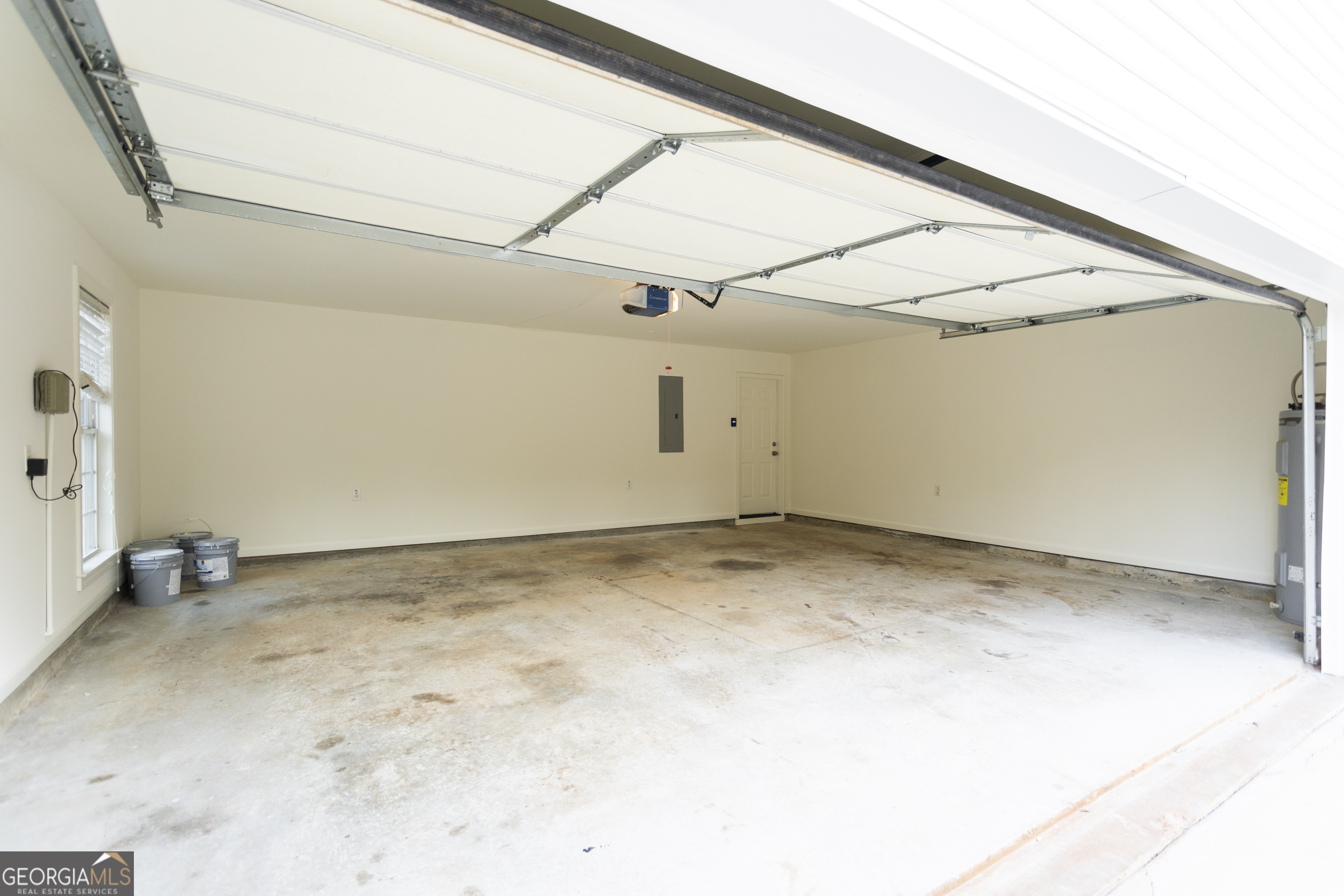 931 Bethany Road Covington, GA 30016 - Photo 53 of 83 a view of a room with rack and wooden floor