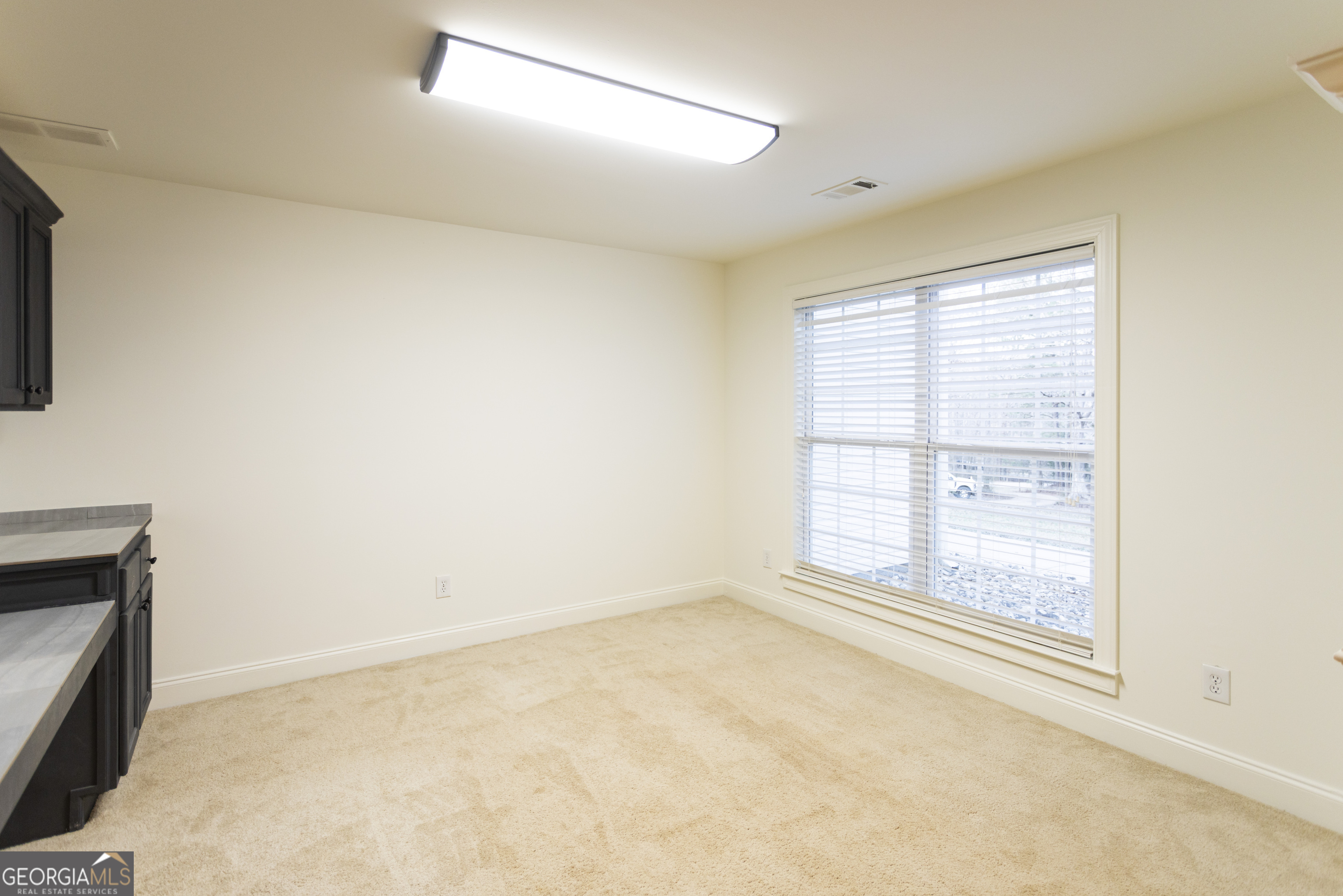 931 Bethany Road Covington, GA 30016 - Photo 54 of 83 a view of an empty room with a window