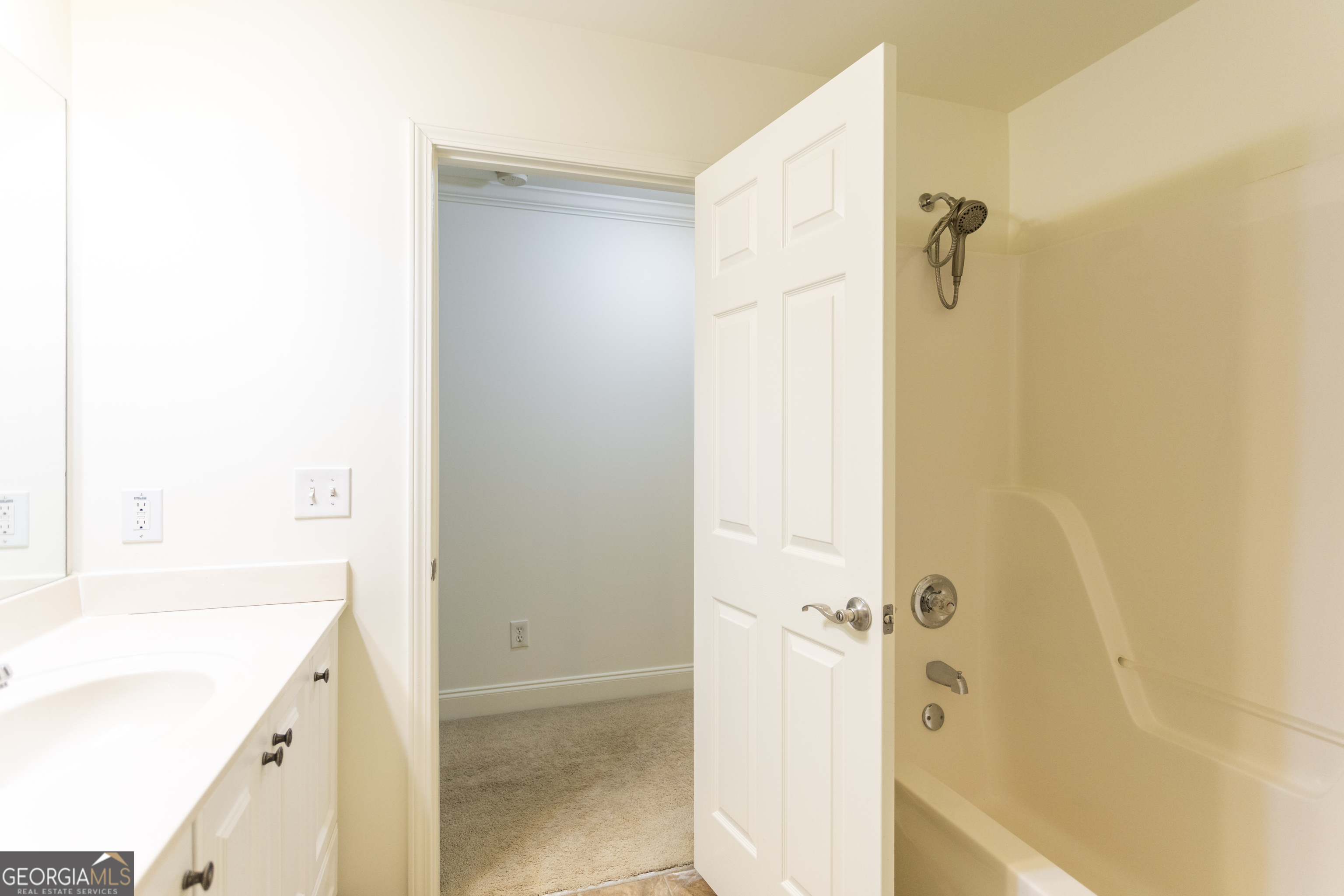 931 Bethany Road Covington, GA 30016 - Photo 68 of 83 a bathroom with a bathtub and a shower