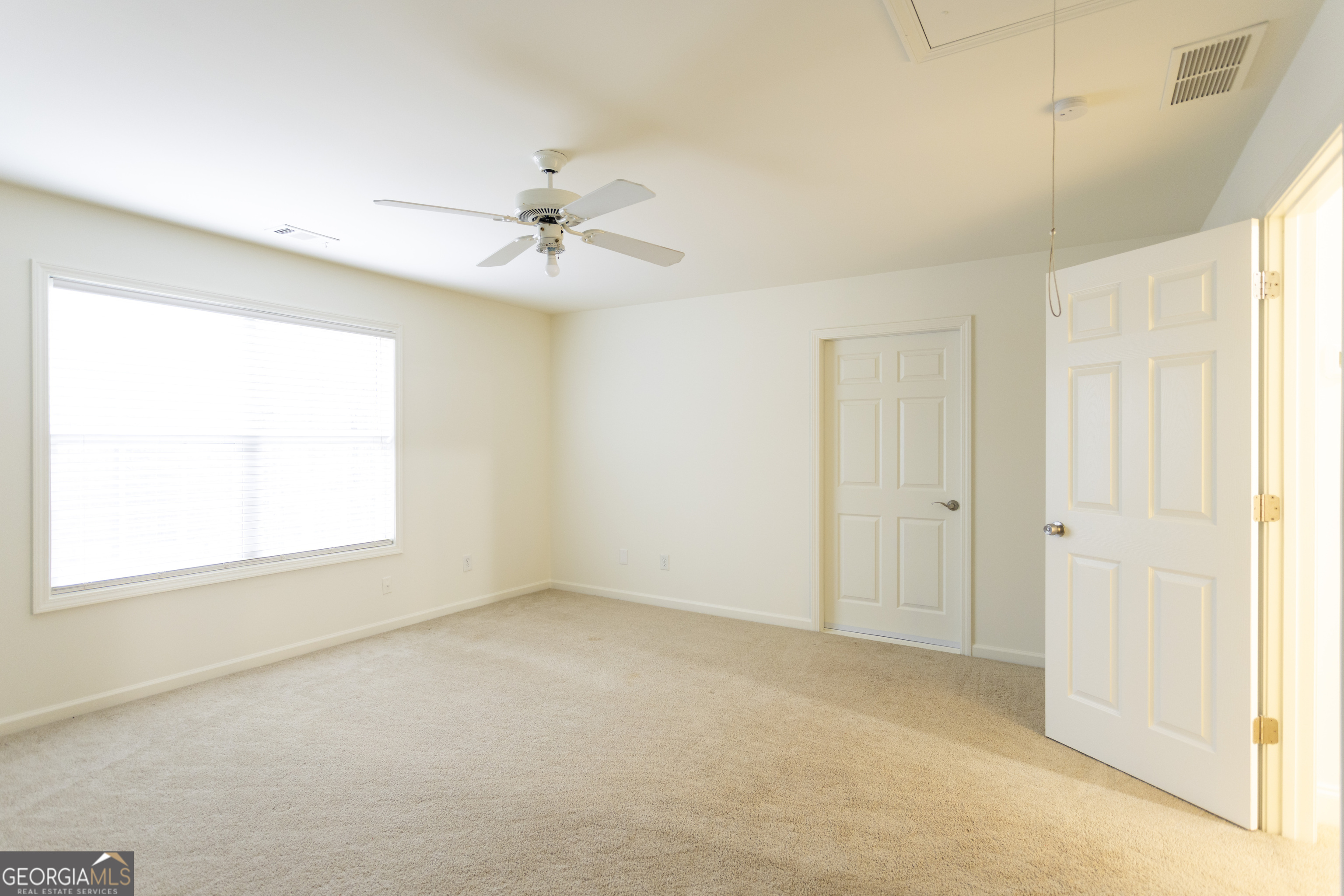 931 Bethany Road Covington, GA 30016 - Photo 70 of 83 a view of an empty room with a window