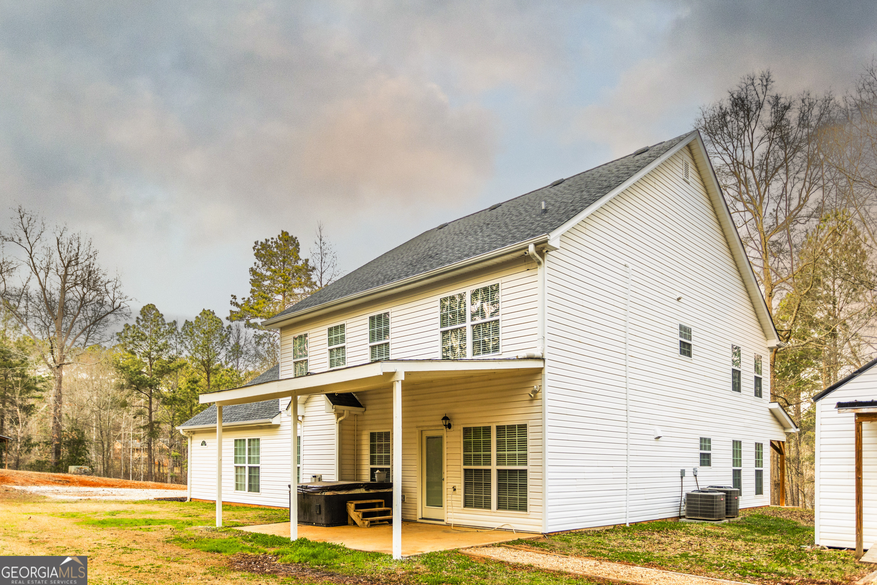 931 Bethany Road Covington, GA 30016 - Photo 10 of 83 a view of a house with a swimming pool